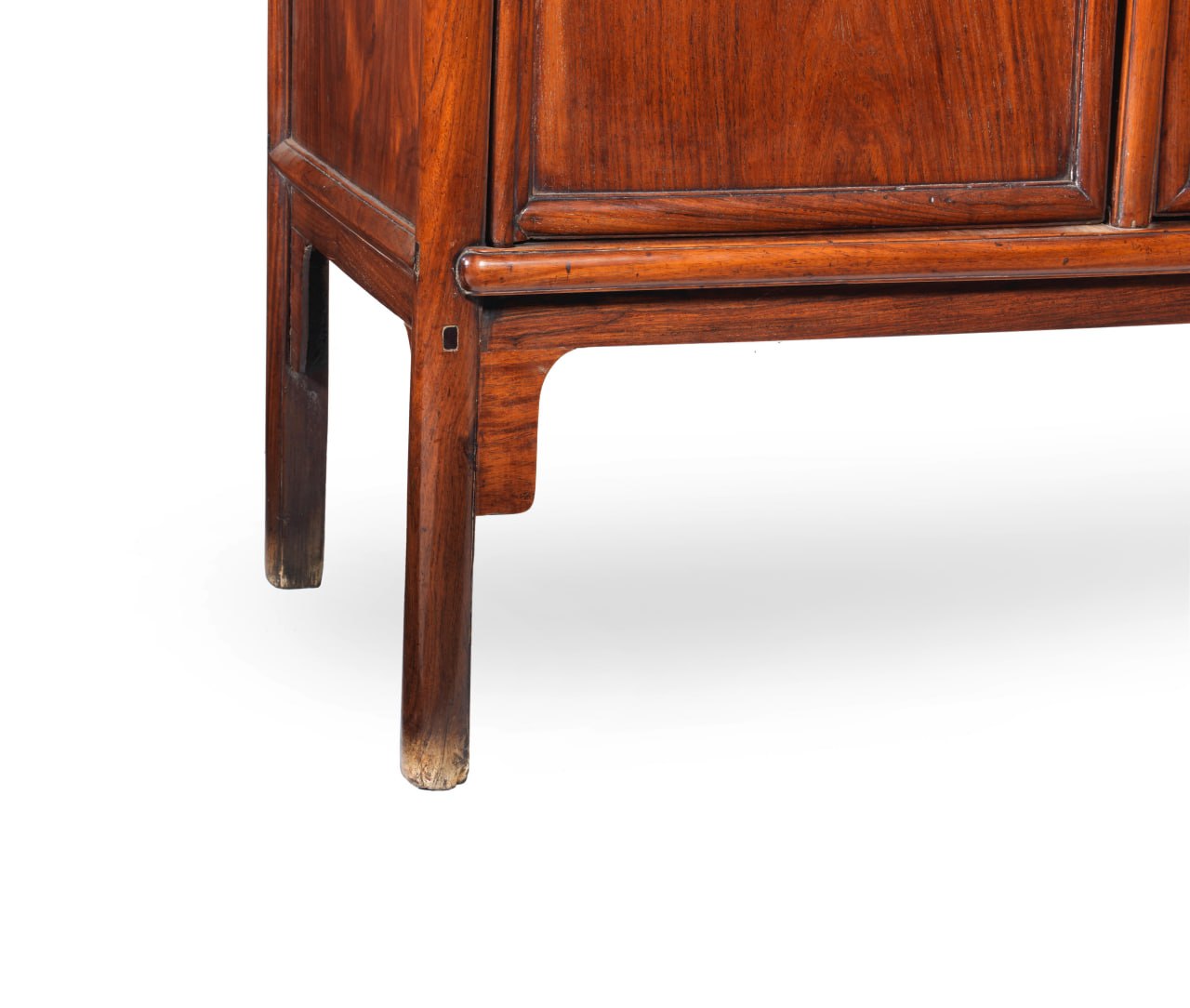 Cabinet leg and apron detail showing age and handling.