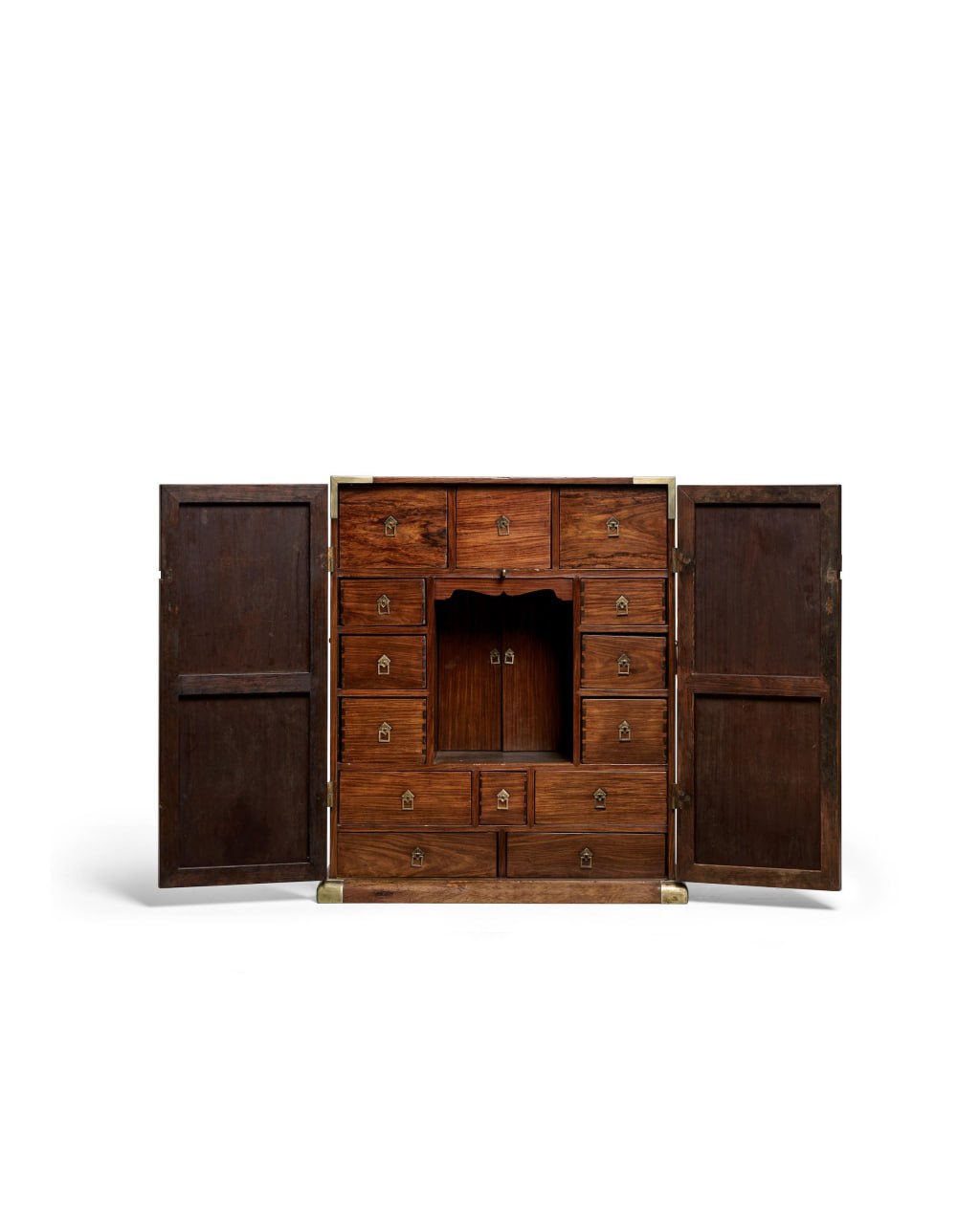 Open huanghuali medicine cabinet with small drawers and brass hardware.